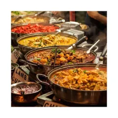 A vibrant display of classic Indian curries, including rich lamb and chicken preparations. Our live Indian food stations offer a variety of beloved dishes, ensuring a hearty and flavorful meal for your guests.