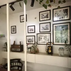 Inside the studio, a bohemian and eclectic style prevails. A gallery wall of my architectural sketches and art is displayed above a vintage Murphy radio and a rotary-style telephone.