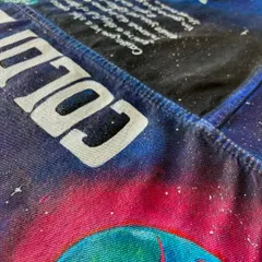 A macro shot of the "COLDPLAY" text painted across the top yoke of the jacket. This shows the clean, bold lettering style I use to make the band's name a central feature of the design.