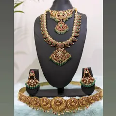 This image shows the versatility of my Jadau collection. Here, the haara and choker are paired with a traditional temple-style hip belt, creating a unique fusion look for a bride.