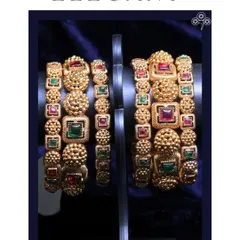 These elegant and heavy bangles with multi-colored stones are perfect for a bride.