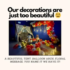 Our beautiful decorations are a key part of the experience. This setup shows a fairy-lit tent, a full balloon arch, and our signature floor fog, all available to make your event extra special.