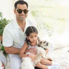 A proud dad with his daughter and their two fluffy companions. I have plenty of experience working with animals to ensure we get great shots where everyone is looking happy.