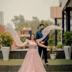 A playful and dynamic shot of the couple. Mansi's veil flows in the wind, adding a sense of movement and joy to this beautiful outdoor portrait.