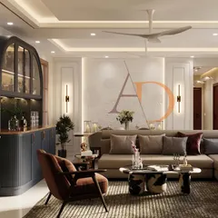 Here, you can see the interplay of textures, from the plush L-shaped sofa to the fluted bar cabinet and classic wall mouldings, all brought together with warm, ambient lighting.