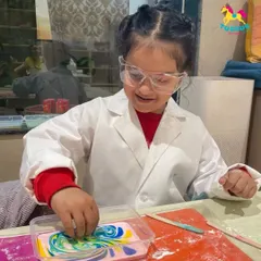 In our Little Scientist's Lab, every child becomes an inventor. Dressed in lab coats, they get to mix, pour, and create everything from colorful slime to fizzing bath bombs, making science tangible and exciting.