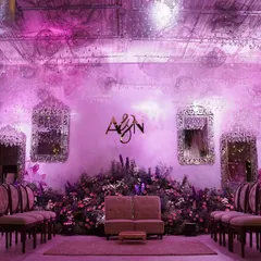 For this engagement, I created a dreamscape in shades of lilac and blush. The stage was set with a field of flowers, vintage mirrors, and a ceiling of cascading crystals, all bathed in a soft, romantic purple light.