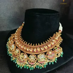 The 'after' of the transformation. The original gold necklace is now a grand, contemporary piece adorned with Basra pearls, rubies, and emeralds, completely reimagined while preserving its soul.