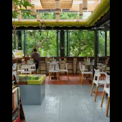 Champaca Bookstore is a sanctuary designed for quiet contemplation. We used simple plywood and custom bamboo lighting, but the main feature is the large window, which frames the lush outdoor greenery and brings a sense of natural calm into the reading space.