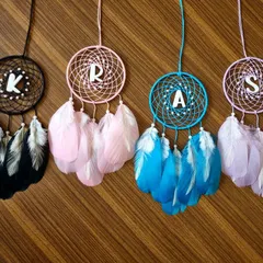 Personalized car hanging dreamcatchers with initials 'K', 'R', 'A', and 'S'. These make fantastic, custom return gifts for any event, allowing each guest to receive a personal token.