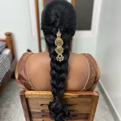 For my client Subha, we created this neat heart braid. It's a unique and beautiful traditional hairstyle that looks stunning with a saree.