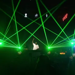 The atmosphere is everything. I work with stunning laser light shows to transform any venue, creating an immersive and high-energy environment for your party.