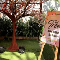 The 'Wish Tree' is a wonderful way for guests to share their blessings. Here, guests can write a wish for the bride and hang it on the tree, creating a beautiful and interactive keepsake.