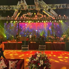 The stage is set for an unforgettable performance at a royal wedding reception. I handle the complete production, including the complex trussing, dynamic lighting, and large-scale LED screens required for a concert-level entertainment experience.