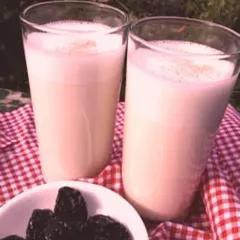 Two glasses of my nutrient-packed Sesame Almond Latte, served with dates. This plant-based milk is incredibly rich in calcium and is a wonderful, healthy alternative to dairy.