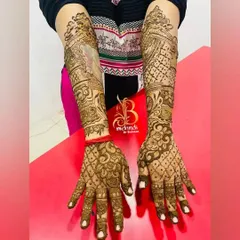 Another view of the full-arm henna with the custom pet portrait. This angle shows how the entire design flows together from the hands to the elbows.