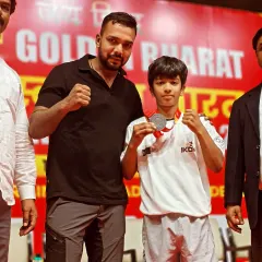 Another one of my young fighters with his medal after a competition. I am proud to coach the next generation.