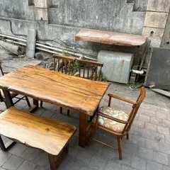 A close-up of the live-edge bench and table, highlighting the sturdy base and rustic charm.