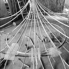 The initial stages of weaving the Biergarten light fixture. We designed the metal framework and then collaborated with artisans to test different weave densities, ensuring the final piece would cast the perfect ambient light.