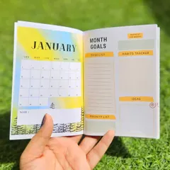 Inside the monthly planner, each month has a unique design. The layout includes a calendar, a to do list, a habit tracker, and space for goals and ideas to help you plan your month effectively.