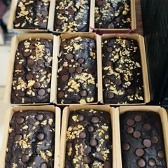 A batch of my whole wheat jaggery Belgian chocolate tea cakes. These loaves are a popular healthy option, providing rich chocolate flavor from whole-food ingredients.