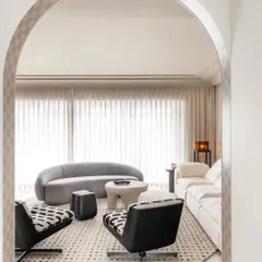 The living room was envisioned as a sanctuary for the family. We used a mix of comfortable, modern furniture and a soft, neutral palette to create a space that accommodates everything from chess games to family gatherings.