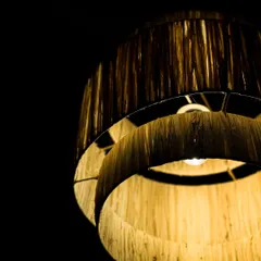 A close look at the texture of my tiered natural fiber lampshade. You can see the individual strands and the slight variations that are the hallmark of a truly handmade object.