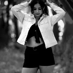A candid moment captured in black and white. The lack of color draws attention to the emotion and the beautiful natural light.