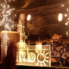 A great set needs a great stage. This shot from Cafe Mambo, framed by sparklers, shows how I integrate with full production setups to create a visually stunning experience that matches the intensity of the music.