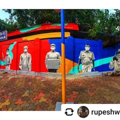 A panoramic mural in Mahim dedicated to the "Covid Warriors." The artwork honors doctors, police officers, and delivery personnel who worked on the frontlines during the pandemic.