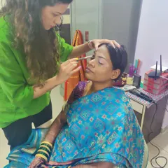 Here I am in action, creating the perfect base for my client. A smooth, even canvas is the secret to a makeup look that lasts all day and looks amazing in photos.