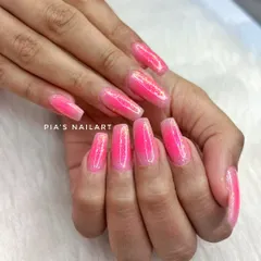 Pink aura nails with galaxy glitter flakes for a magical, out-of-this-world effect.