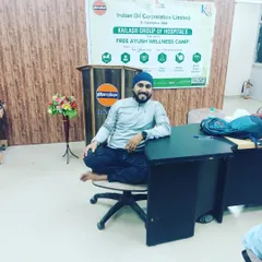 Taking a moment during a yoga event at the Indian Oil Corporation in Meerut. I often demonstrate how simple seated poses can be done even at an office desk.