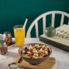A fresh and crisp salad in a rustic bowl. This shot for The Humble Pizzeria is bright and clean, highlighting the freshness of the ingredients and presenting a healthy, delicious option.