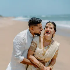 The pure, unscripted laughter of a couple sharing a moment on the beach. This is what destination weddings are all about: creating beautiful memories in a place that feels like paradise.