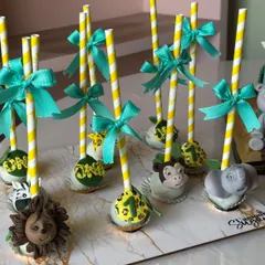Another view of our jungle themed cake pops, each decorated with a cute ribbon and a "one" tag for a first birthday celebration.