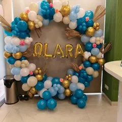 Another angle of the blue and gold balloon ring, showing its full, lush shape.