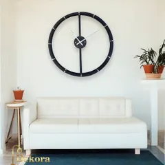 Our minimalist round wall clock, shown in a bright and airy room, complements the clean and modern aesthetic.