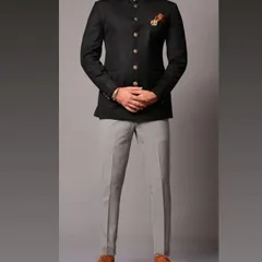 A timeless black bandhgala Jodhpuri suit paired with contrasting grey trousers. This is a versatile Indo-Western outfit I can tailor for any formal occasion, ensuring a perfect fit.