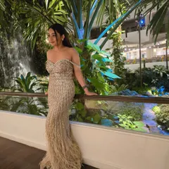 A stunning feather gown for an event in Thailand. I love dressing up for destination weddings and bringing a touch of glamour to every location.