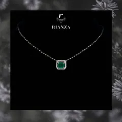 For the bride who loves a touch of color, this mangalsutra features a precious emerald-cut gemstone surrounded by a halo of diamonds. It is a unique and standout piece.