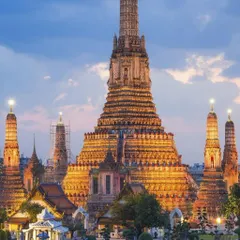 Thailand isn't just beaches. We make sure you experience its rich culture, like visiting the magnificent Wat Arun temple in Bangkok, especially as it lights up beautifully at dusk.
