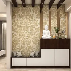 A beautiful foyer setup featuring a two-tone cabinet with an integrated bench for seating. The damask-patterned wallpaper and a large white Buddha statue create a serene ambiance.