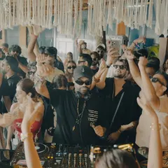 Hands up for the daytime madness in Goa. This shot captures the collective energy of a sun-soaked dance floor.