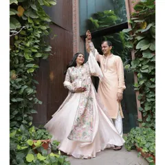A playful, dancing shot with her husband. It's all about celebrating this joyful milestone together.