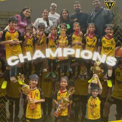 The entire U8 squad celebrating their championship win with coaches and parents. Victories are a team effort, and our SMFA family celebrates together.