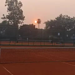 A view across our clay courts at sunset. We maintain a focused and disciplined atmosphere from the first match in the morning to the last practice session in the evening.