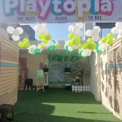 Our entrance decorated for a football-themed party. The green turf and balloon goalpost set the stage for a sporty celebration.