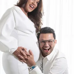 The pure joy of expecting. This all-white studio session captures the fun and excitement between a couple as they await their new arrival. My goal is to make you feel comfortable, so your real personalities shine through.