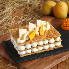 Our irresistible Mango Mille-feuille is here. It features layers of flaky pastry and smooth vanilla cream, topped with juicy slices of fresh mango for a tropical twist.
